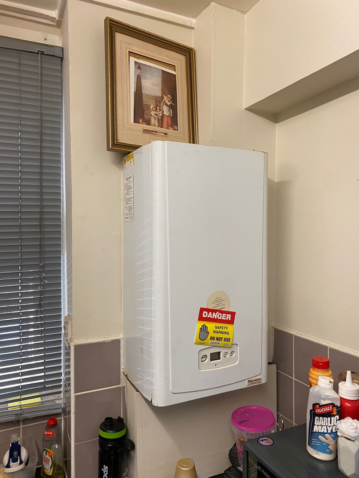 Gas Safe engineer assessing dangerous boiler requiring urgent repair in Finchley